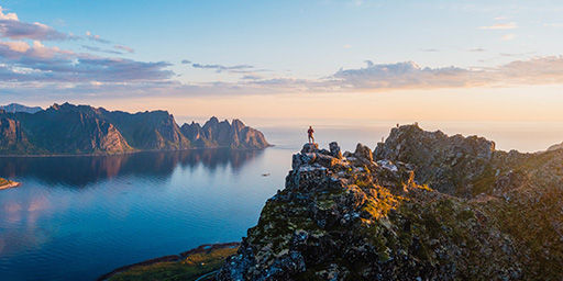 hiker at the top of the mountains